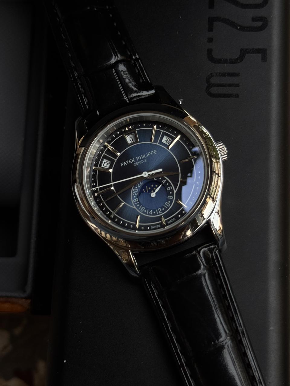 Patekk Philippee Annual Calendar – Blue Sunburst Dial | 18K White Gold | Moonphase Display
