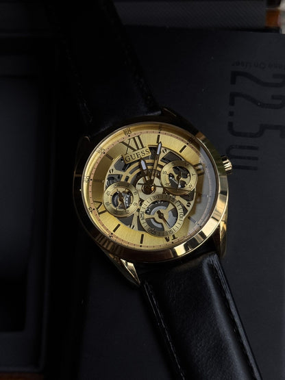 ✨ “Golden Pulse” – Guesss Skeleton Gold-Tone Automatic Watch | Bold. Refined. Unforgettable.